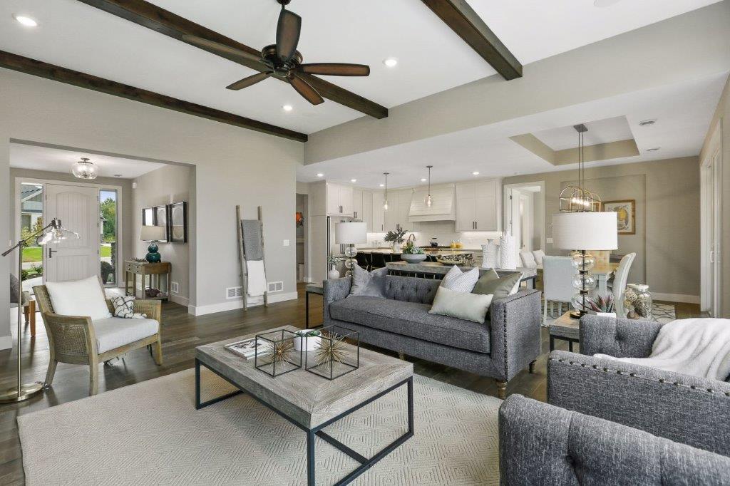 Stunning family room featuring beamed ceiling details