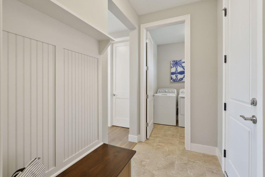 Spacious laundry and mudroom with a walk-in closet