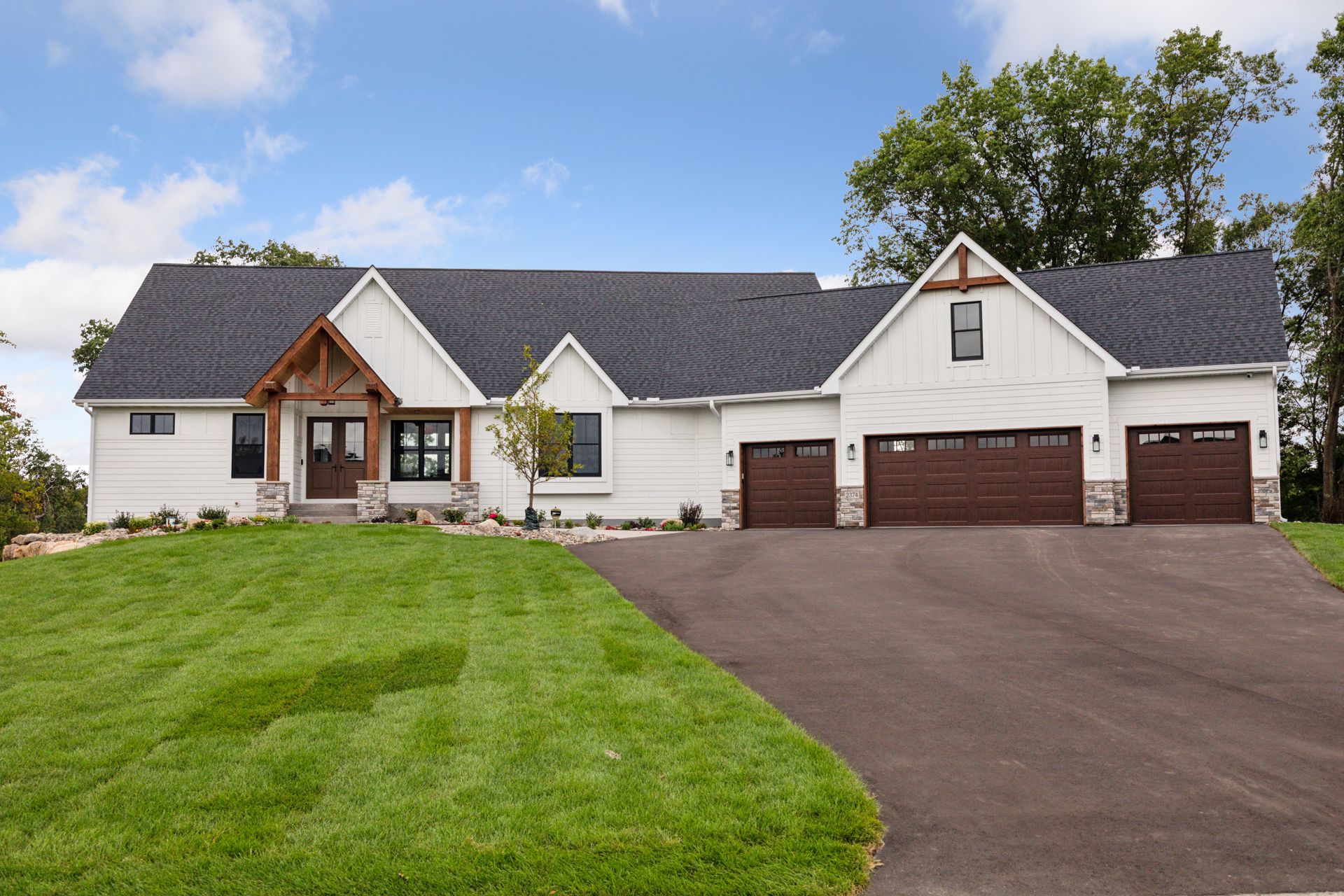 Insulated and heated 4+ car garage with floor drains and finished sheetrock