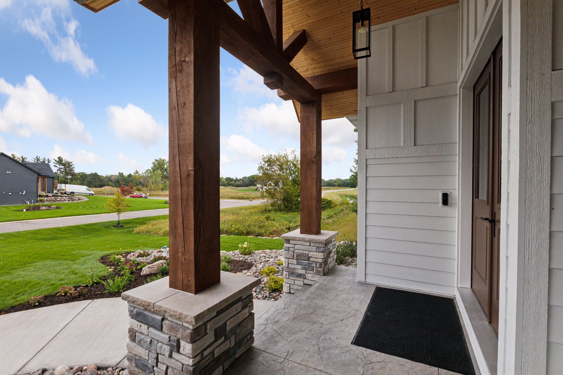 Covered front porch with stamped concrete