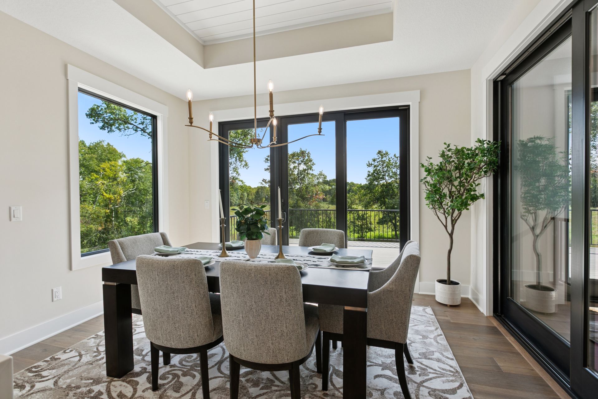 Dining area with large picture window offering scenic views