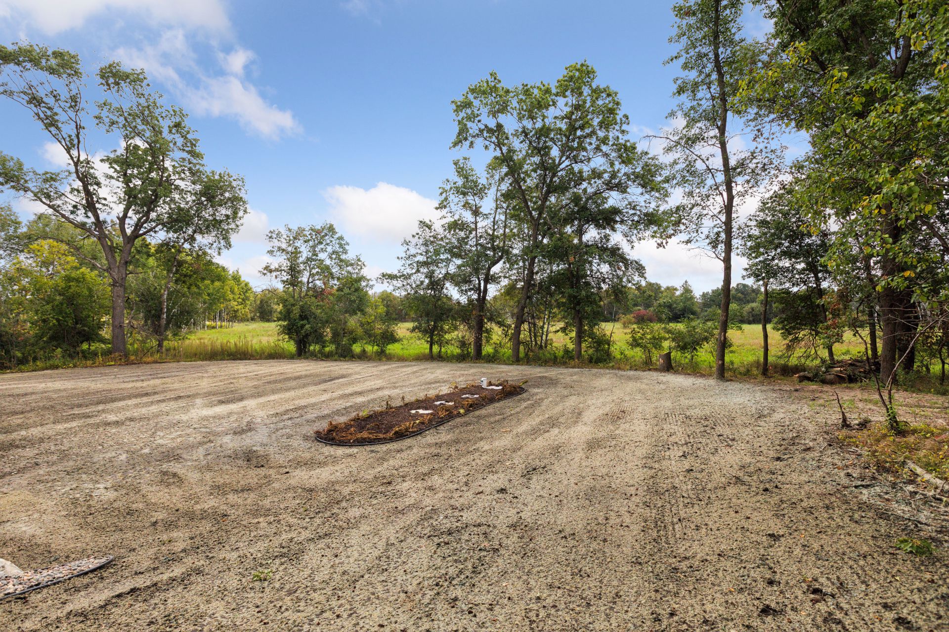 Spacious yard offering expansive views across wooded 4-acre propertyo