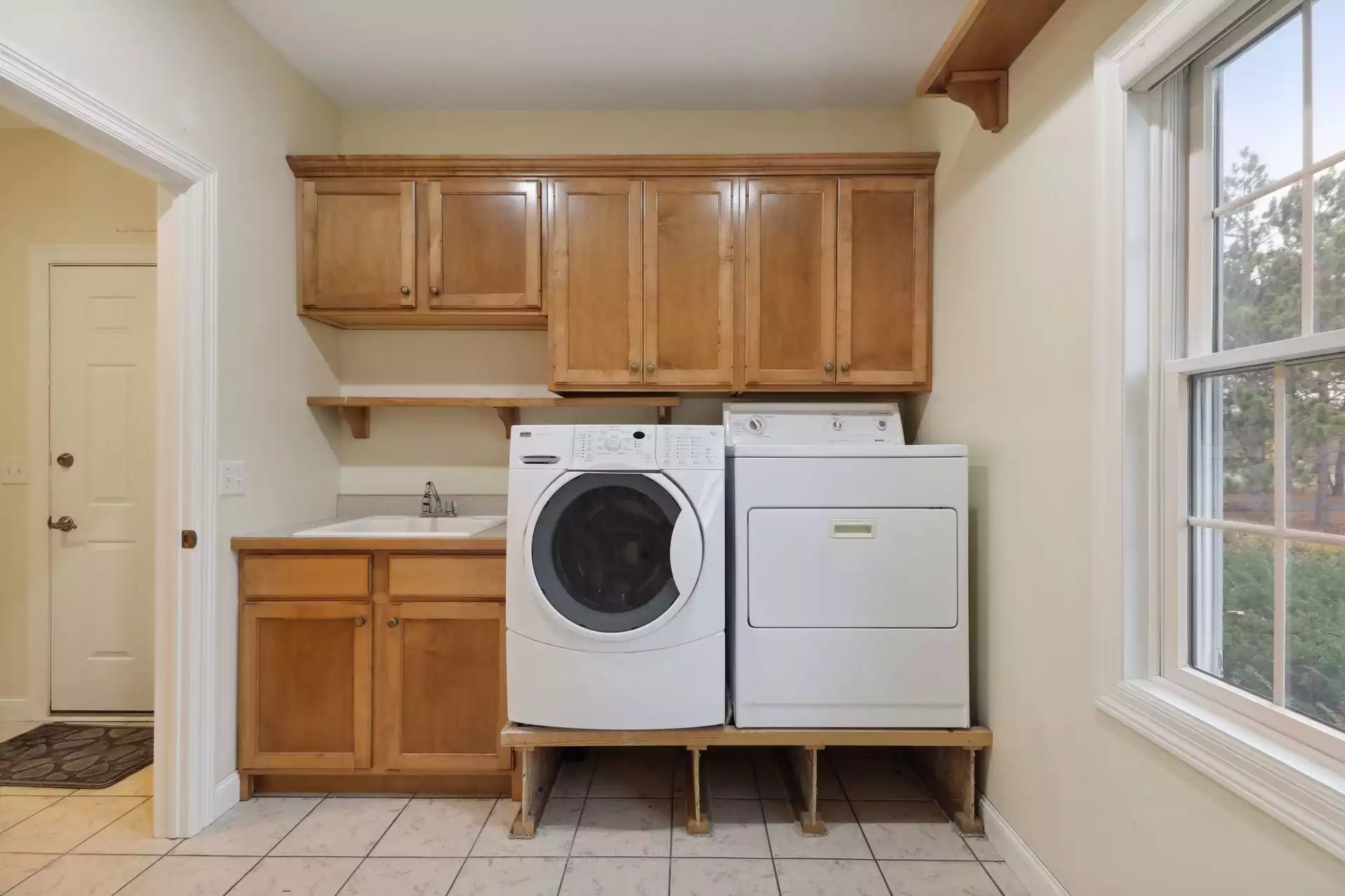 Laundry room washer & dryer on risers