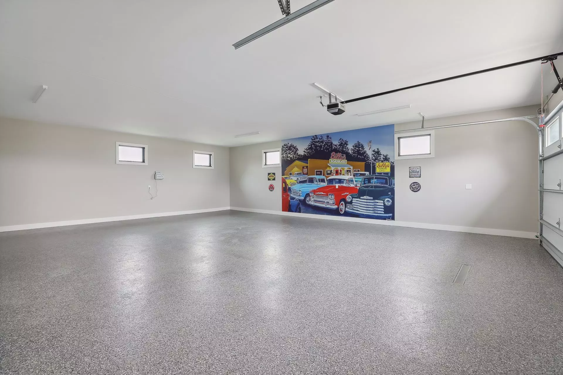 4 Car Oversized Heated Garage with finished walls, epoxy floors and windows