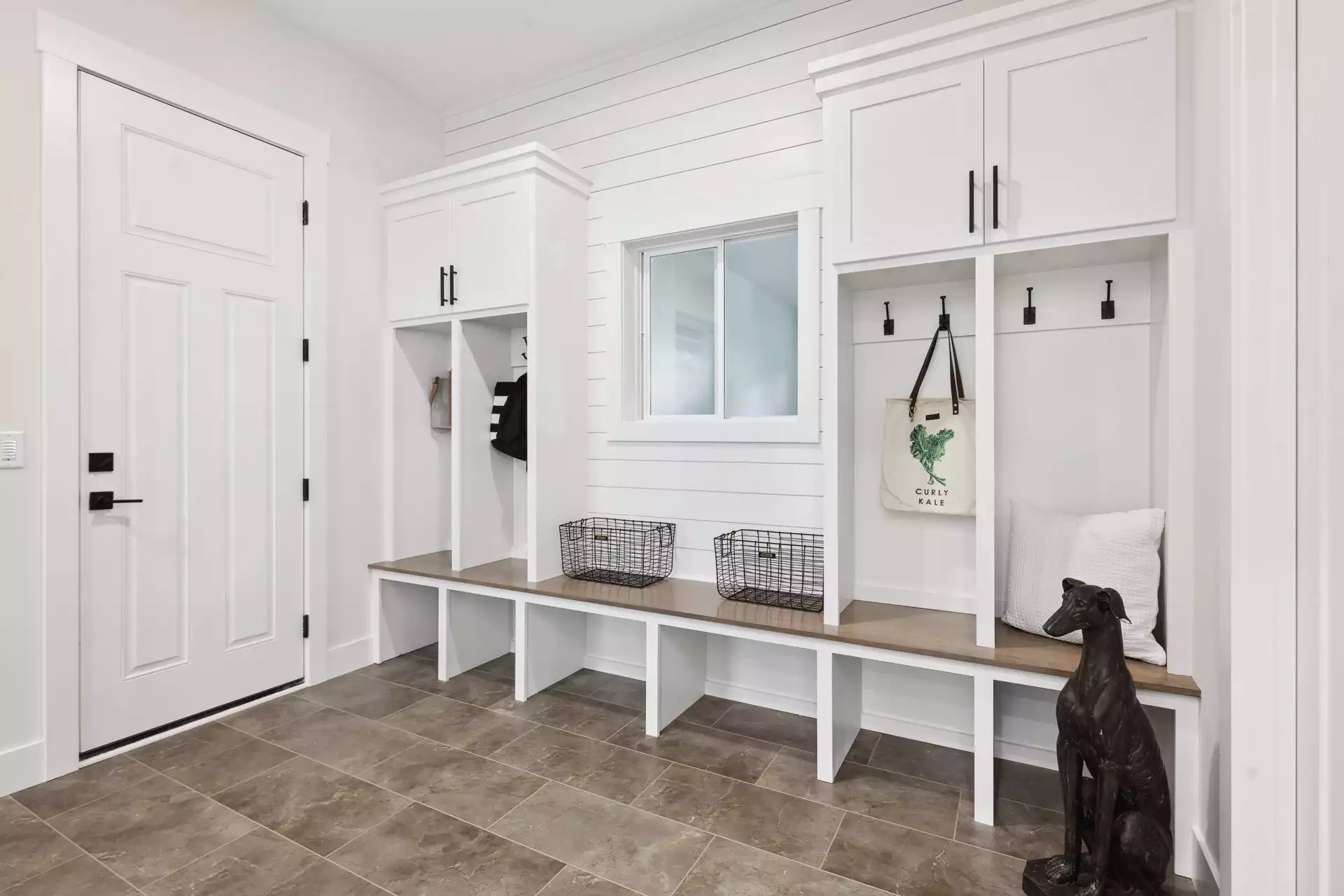 Mud room with built-in cubbies and storage