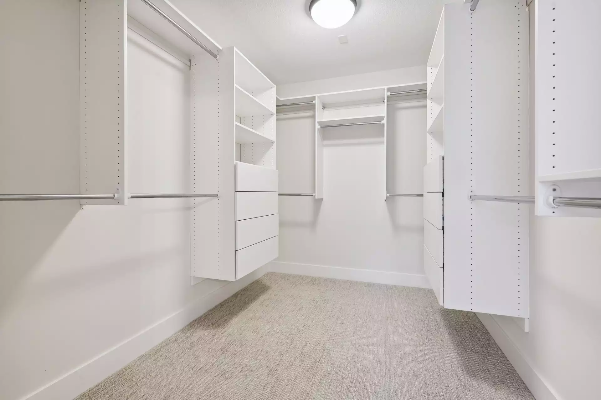 Owner’s suite walk-in closet with organizers