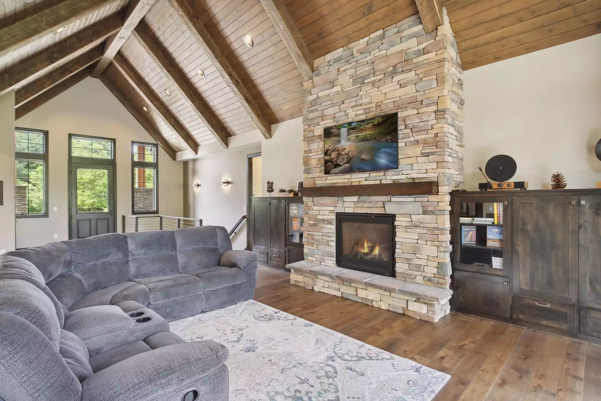 Floor to ceiling stone fireplace